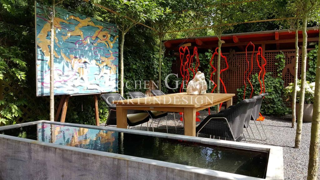 Skulpturengarten Sitzplatz im Schatten Terrassengestaltung Gartendesign